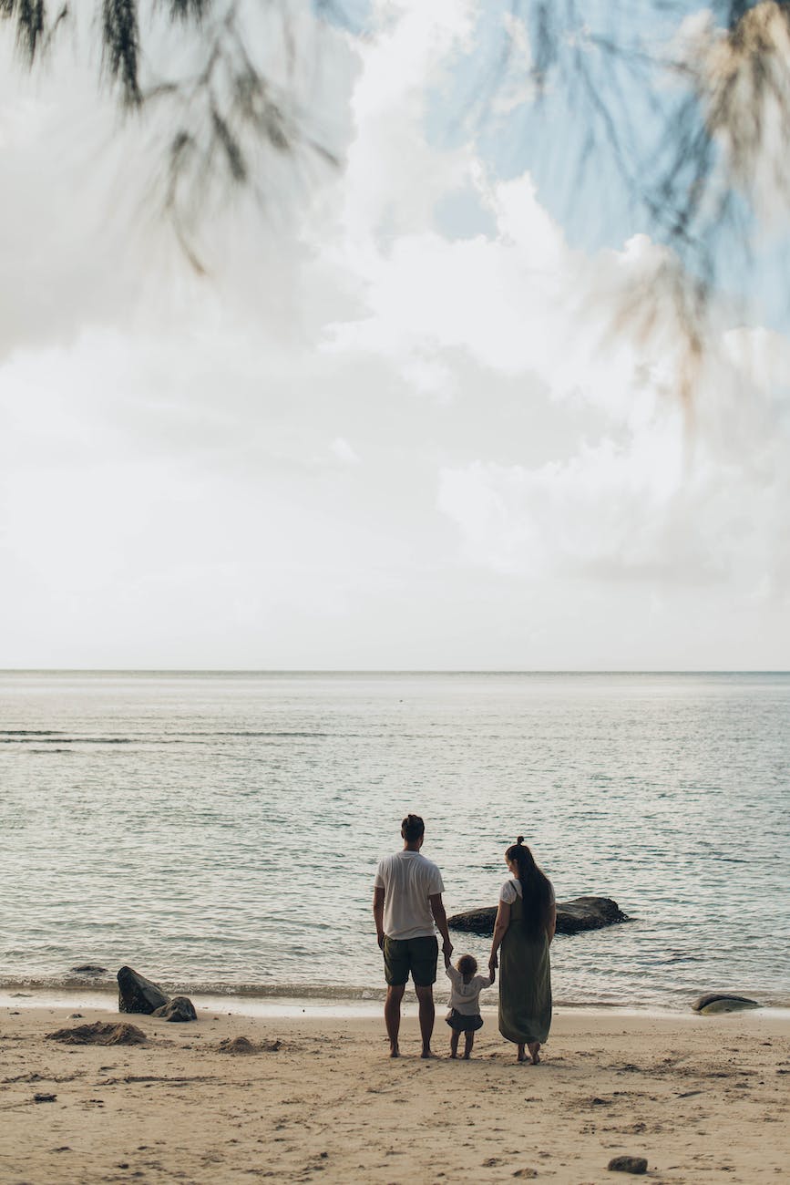 woman and man standing at shores