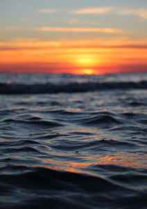 rippled sea surface at sunset