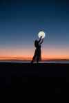 woman holding a moon